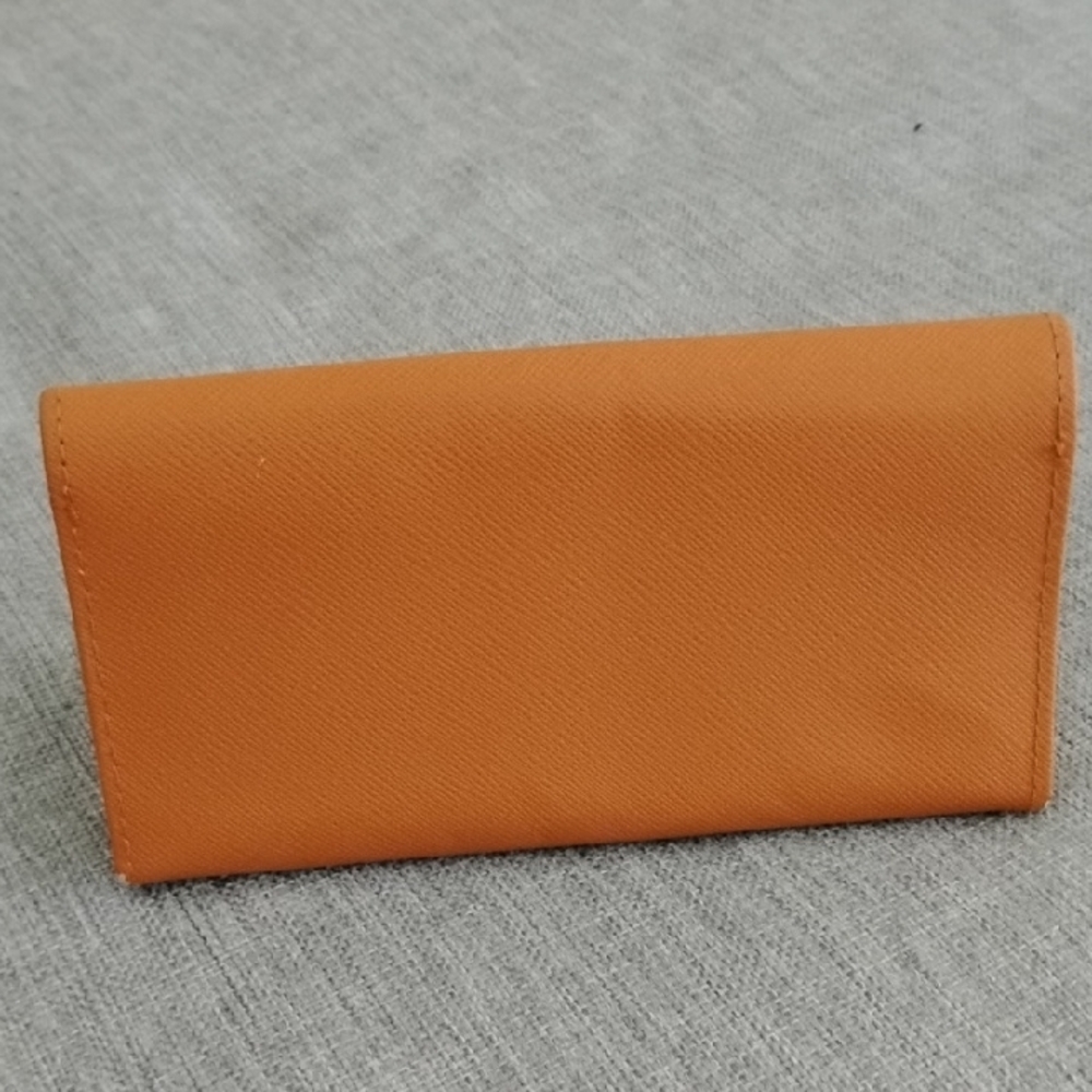 Tory Burch Orange glass case with Silver Logo - Picture 3 of 12